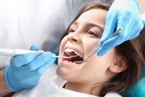 Smiling young girl at orthodontics appointment